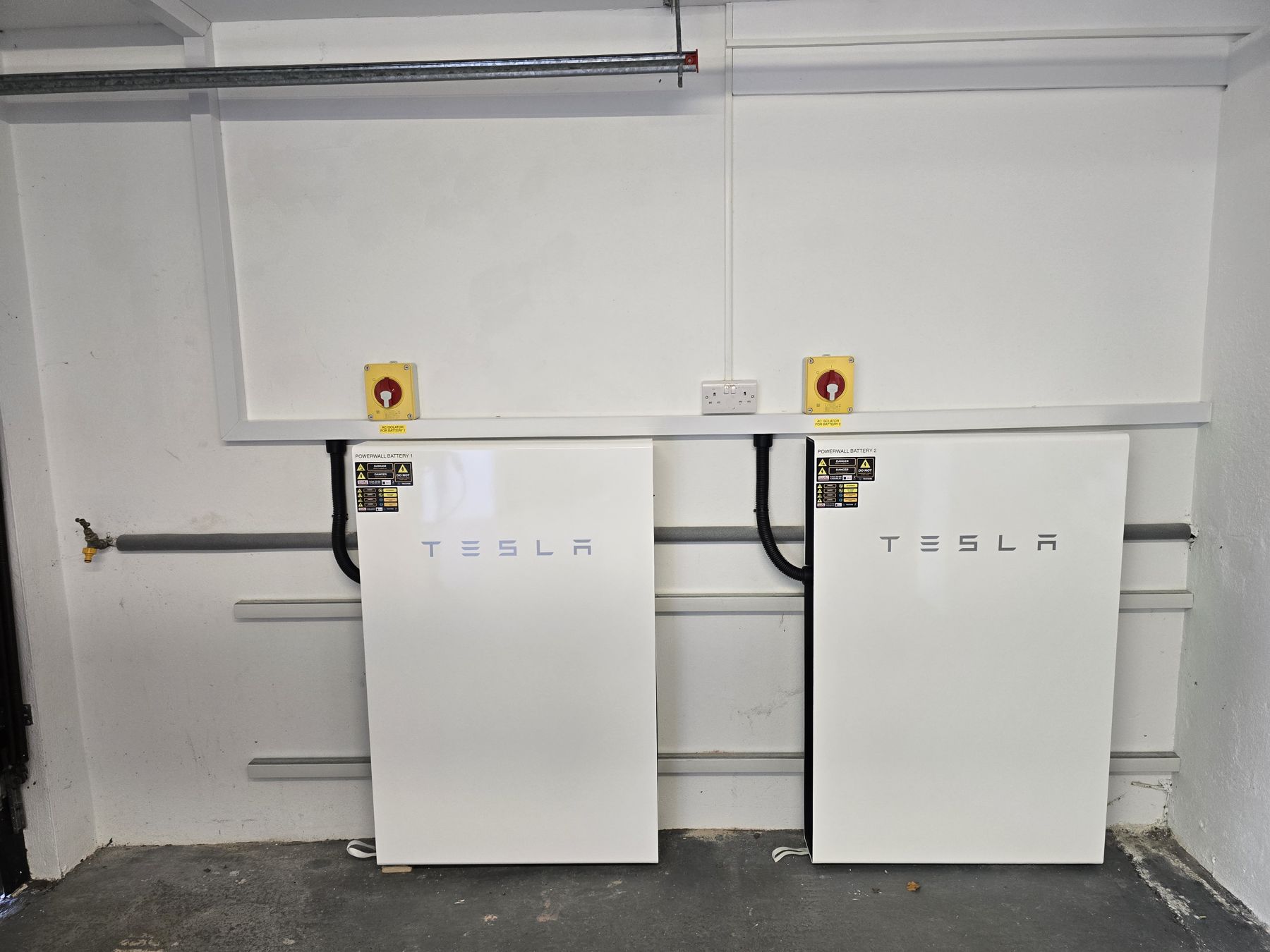 Tesla Powerwall units installed on a wall